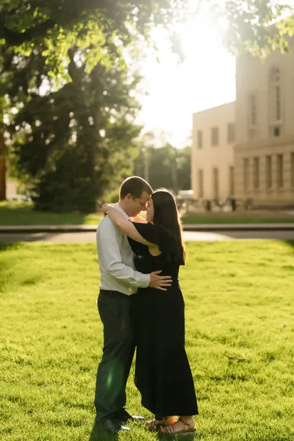 An embrace under the park trees