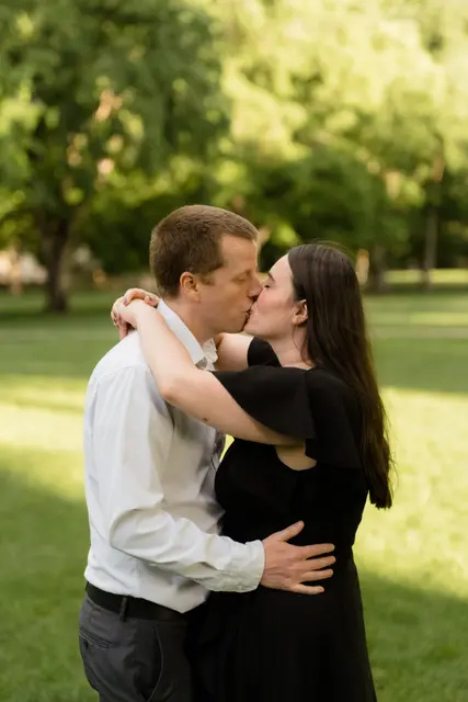 A kiss in the park at golden hour